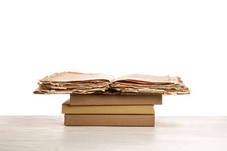 Old books on table against white backgroundの写真素材
