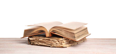 Old books on table against white backgroundの写真素材