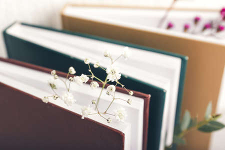 Books with fresh flowers, closeupの写真素材
