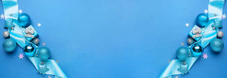Stylish Christmas decor on blue background with space for text