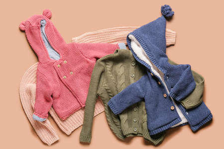 Stylish baby clothes on color backgroundの写真素材