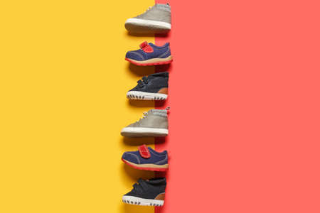 Stylish baby shoes on color backgroundの写真素材