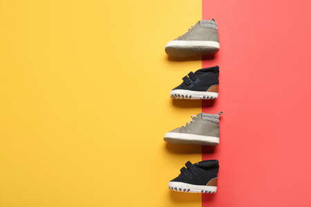Stylish baby shoes on color backgroundの写真素材
