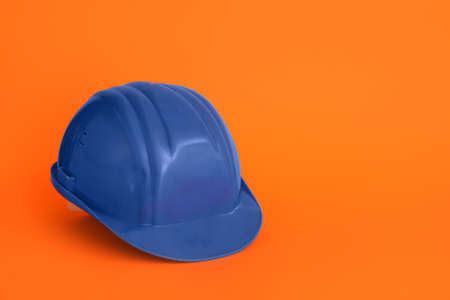 Blue hardhat on color backgroundの写真素材