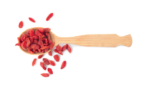 Spoon with dried goji berries on white backgroundの写真素材