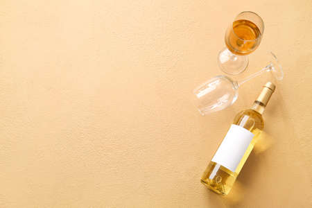 Bottle of wine and glasses on color backgroundの写真素材