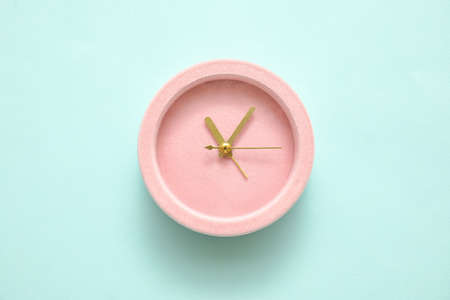 Alarm clock on color background