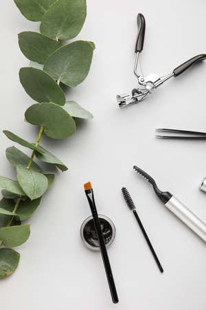 Henna, tools for eyebrows and eyelashes correction on light background