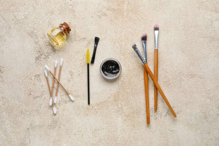 Henna and tools for eyebrows correction on color backgroundの写真素材