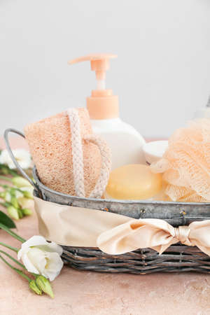 Gift basket with bathroom supplies on tableの写真素材