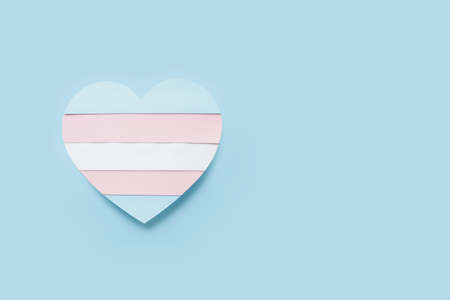Flag of transgender in shape of heart on color background