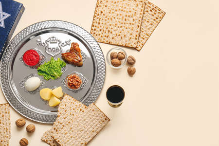 Passover Seder plate with traditional food on light background