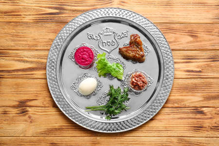 Passover Seder plate with traditional food on tableの写真素材