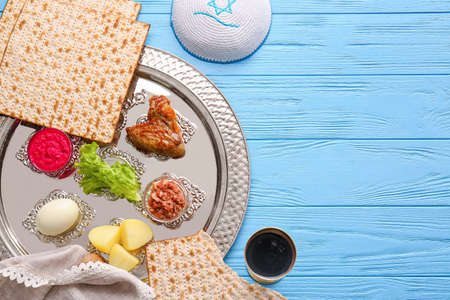 Passover Seder plate with traditional food on tableの写真素材