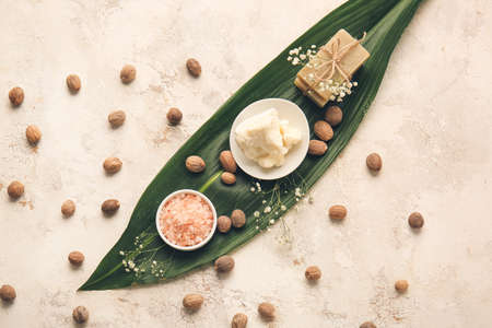 Shea butter with sea salt and soap on light backgroundの写真素材