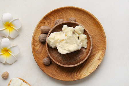 Plate with shea butter on light backgroundの写真素材