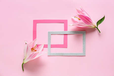 Composition with beautiful lilies on color backgroundの写真素材