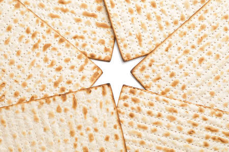 Jewish flatbread matza for Passover on white backgroundの写真素材