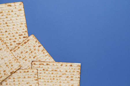 Jewish flatbread matza for Passover on color backgroundの写真素材