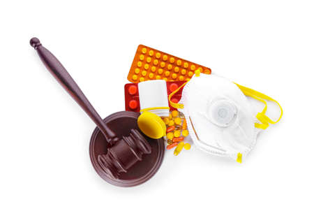 Judge gavel, mask and drugs on white background. Concept of health care reformの写真素材