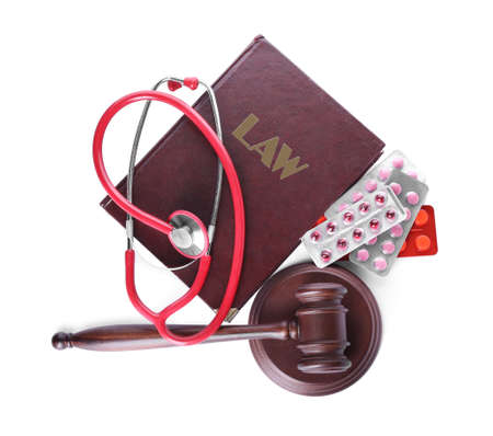 Judge gavel, book, stethoscope and pills on white background. Concept of health care reformの写真素材