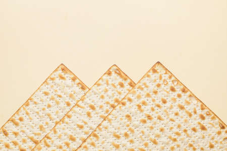 Jewish flatbread matza for Passover on color background