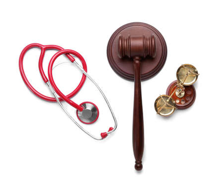 Judge gavel, scales of justice and stethoscope on white background. Concept of health care reformの写真素材