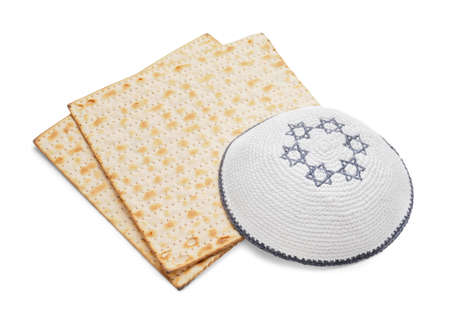 Jewish flatbread matza for Passover and cap on white background