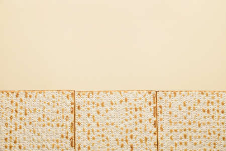 Jewish flatbread matza for Passover on color backgroundの写真素材