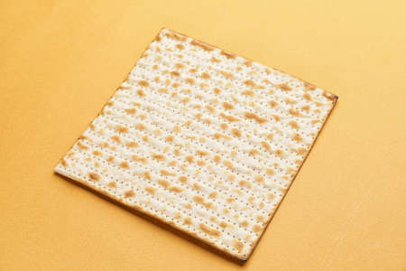 Jewish flatbread matza for Passover on color background