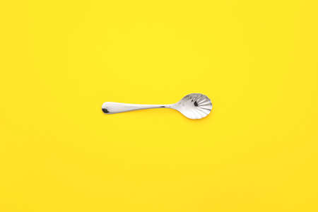 Clean spoon on color backgroundの写真素材