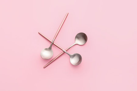Clean spoons on color backgroundの写真素材