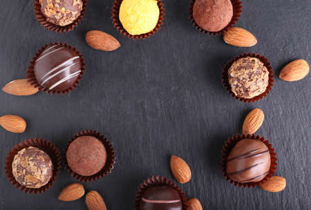 Frame made of sweet chocolate candies on dark backgroundの写真素材