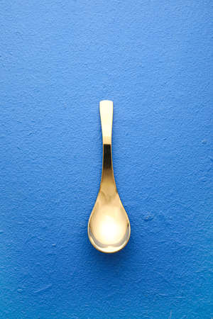 Clean spoon on color backgroundの写真素材