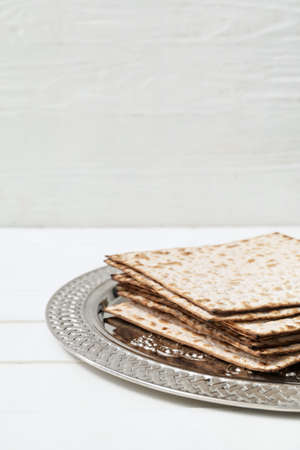 Passover Seder plate with matzo on table, closeup