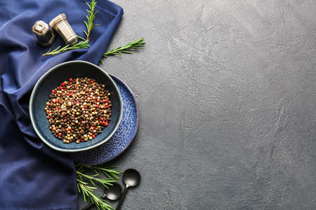 Bowl with mixed peppercorns on dark backgroundの写真素材
