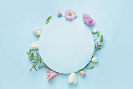 Blank card and beautiful flowers on color background