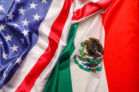 Mexican and USA flags as background, closeupの写真素材
