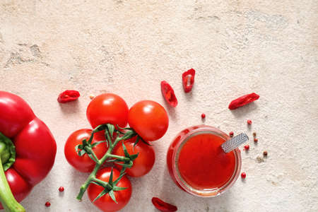 Composition with tasty chili sauce and ingredients on light background, closeupの写真素材