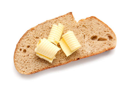 Slice of fresh bread with butter on white background