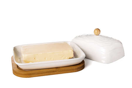 Box with fresh butter on white backgroundの写真素材