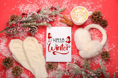 Beautiful greeting card with cup of cacao, mittens and ear warmers. Hello winterの写真素材