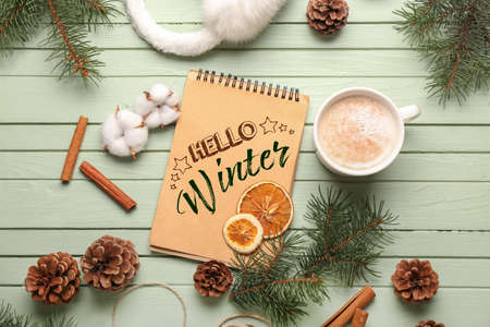 Beautiful greeting card with cup of cacao and floral decor. Hello winterの写真素材