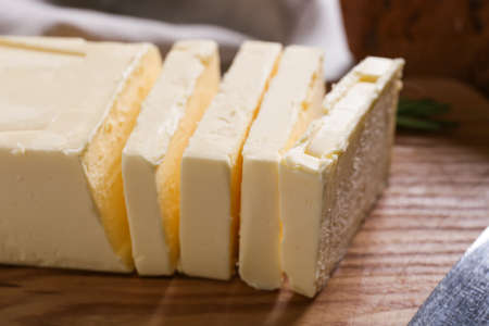 Chopping board with fresh butter, closeup