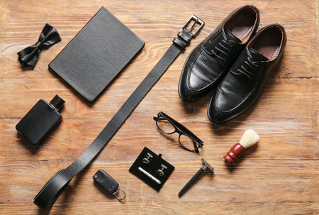 Different stylish male accessories on wooden tableの写真素材