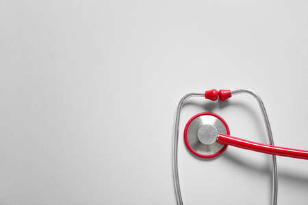 Modern stethoscope on light backgroundの写真素材