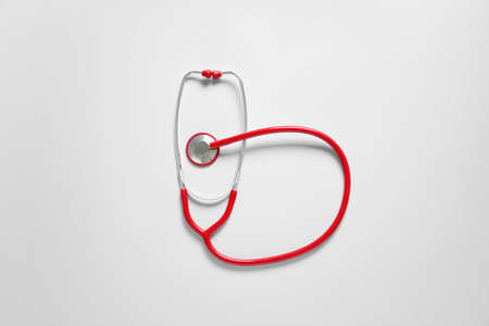 Modern stethoscope on light backgroundの写真素材
