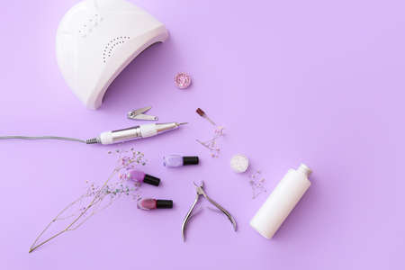 Set of professional tools for manicure and nail polishes on color backgroundの写真素材