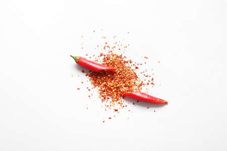 Fresh and dry ground chili pepper on white background