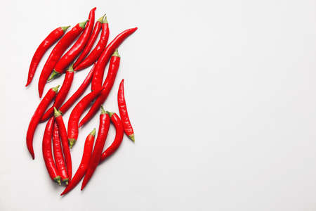 Hot chili peppers on white backgroundの写真素材